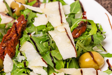 Fresh arugula with grated parmesan