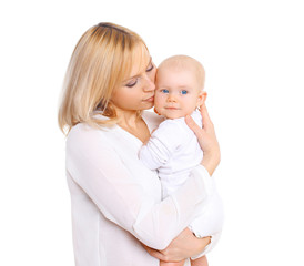 Happy mother hugging her baby on a white background