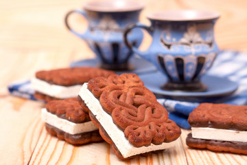 zephyr cookie with tea on wooden background