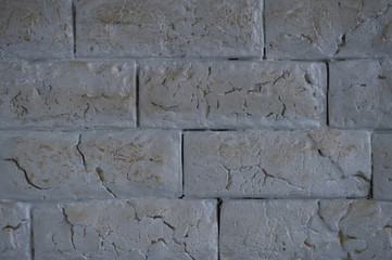 light cracked bricks on wall with tiles
