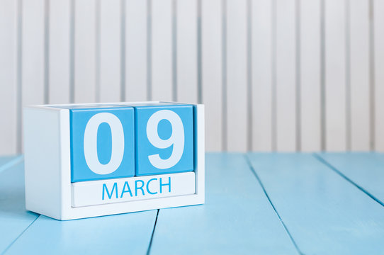 March 9th. Image of march 9 wooden color calendar on white background.  Spring day, empty space for text. World DJ Day