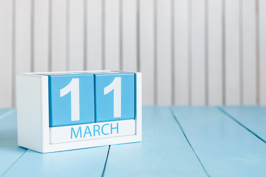 March 11th. Image of march 11 wooden color calendar on white background.  Spring day, empty space for text. World Day Of the writer