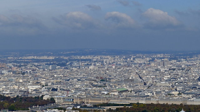Panoramic footage in 4k with Paris from Montparnasse tower. Aerial view including Louvre Museum and different historical and commercial buildings.