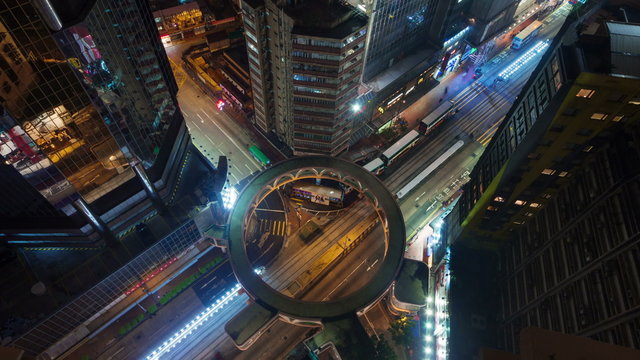 night light traffic crossroad with round road 4k time lapse from hong kong roof 
