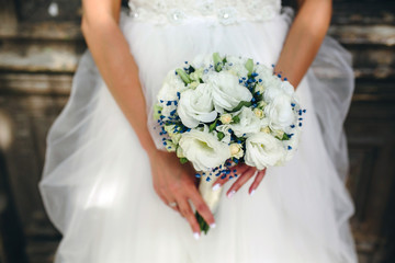 bride holding beautiful wedding bouquet