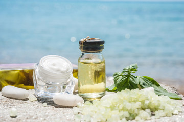 Natural facial cream and sea as background 