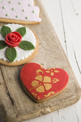 Decorated cookies with wedding, heart and flower cake shape