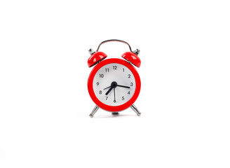 red alarm clock on a white background