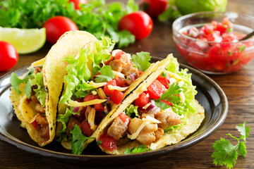 Tacos with pork and tomato salsa.