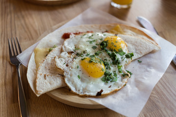 Fried eggs on a tortilla wrap