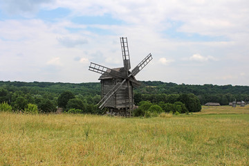 Naklejka na ściany i meble Windmill in the village