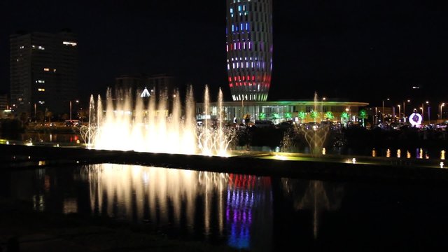 Night view of the dancing fountains and House of Justice.Colorful spectacle in the city center of Batumi
