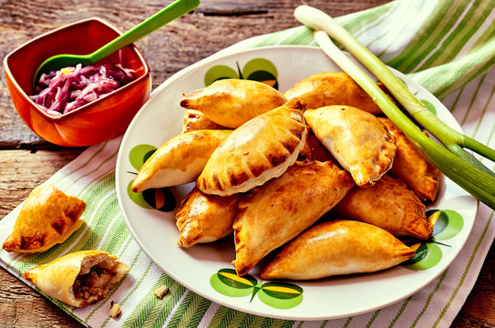 Baked Empanadas Served with Fresh Green Onions