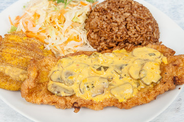 fried sea bass fillet with mushroom sauce