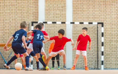 Rolgordijnen Little Boys playing soccer © Dusan Kostic