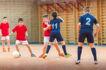 Foto op Canvas Little Boys playing soccer © Dusan Kostic