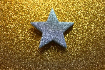 bright silver star on golden background