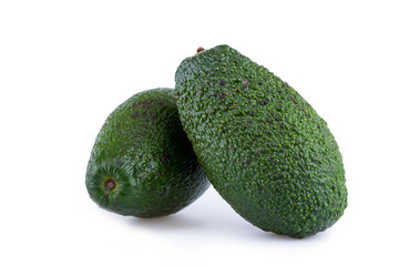 Two avocados isolated on a white background.