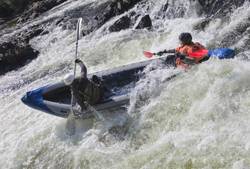 Kayakers in whitewater