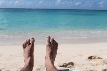 Vacation holidays. Men feet closeup   
