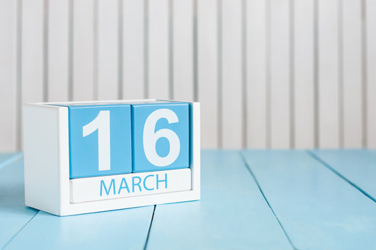 March 16th. Image of march 16 wooden color calendar on white background.  Spring day, empty space for text