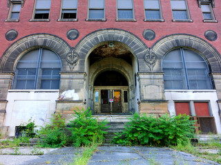 Abandoned brick school building exterior - landscape color photo