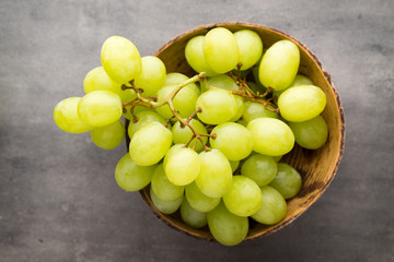 Grape cluster on the grey background.
