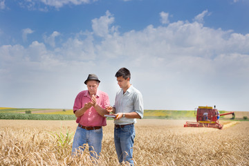 Peasant and businessman at harvest