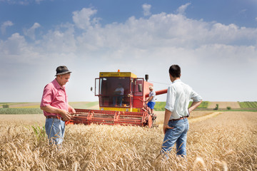 Peasant and businessman at harvest