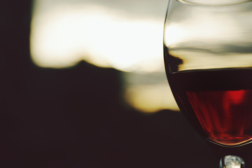 Glass of red wine on blurred background