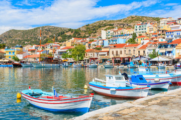 Fototapeta na wymiar Traditional colourful Greek fishing boats in Pythagorion port, Samos island, Greece