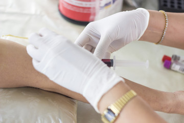 Nurse doing blood tests to check