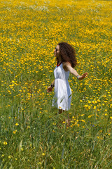 Fototapeta premium pretty girl in the flower field