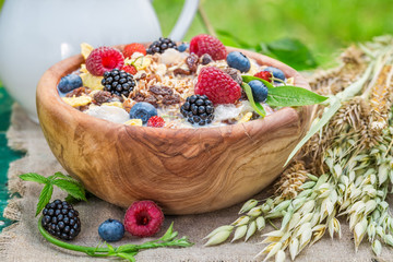 Tasty breakfast with milk and berry fruits