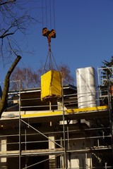 Building crane under blue sky 