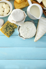 Set of fresh dairy products on blue wooden table, close up