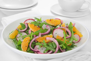 Salad with arugula, radish,red onion and tangerine
