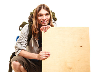 Man hiker backpacker with blank wood copy space ad