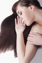 Naklejka premium Health and Beauty Concept. Cute Caucasian Brunette Female With Nice Long Hair