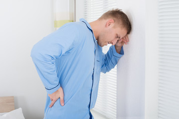 Fototapeta premium Young Man Suffering From Back Ache
