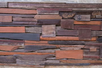 Wall made  by pieces of woods. Patched, nailed and stick up on the wall to make different texture. Vintage