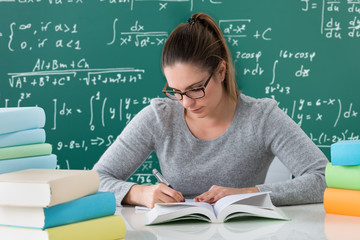 Woman Writing With Pen In Book