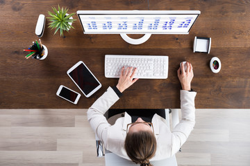 Businesswoman Looking At Calendar On Computer