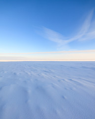 Frozen lake scape and blue sky