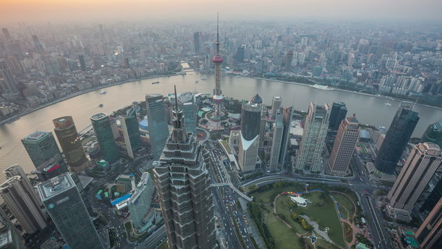 4K(4096x2304) :Shanghai from day to night, time lapse. Aerial view of high-rise buildings with Huangpu River in Shanghai, China.