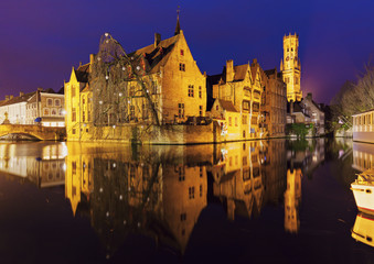 Fototapeta na wymiar Belfry of Bruges reflected in the canal