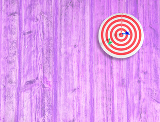 dart target on color wood wall