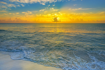 Fototapeta na wymiar Colorful sunset on the tropical beach with beautiful sky, clouds