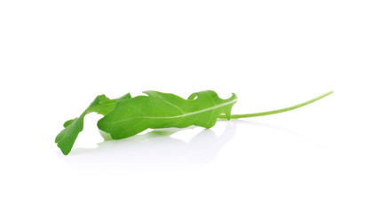 Obraz premium Sweet rucola salad or rocket lettuce leaves isolated on white ba