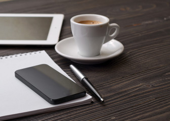 Fototapeta na wymiar the workplace black smart phone with notebook